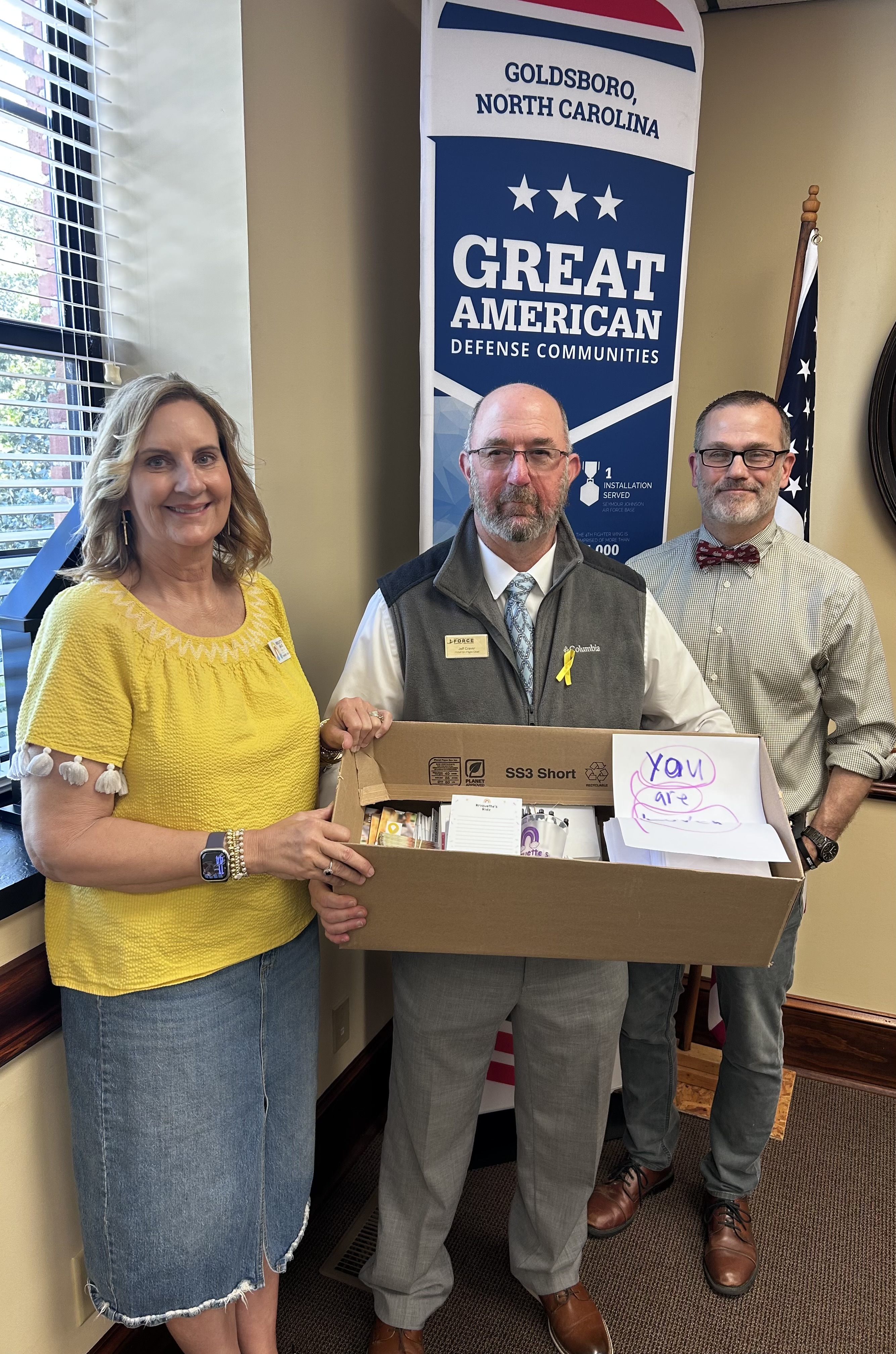 Kriquette's Kidz delivering restaurant gift cards to military families at SJAFB